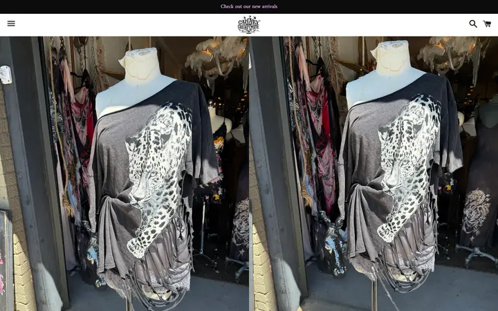 /collections/new-arrivals/products/big-cat-ripped-t — Canary in a Clothesmine